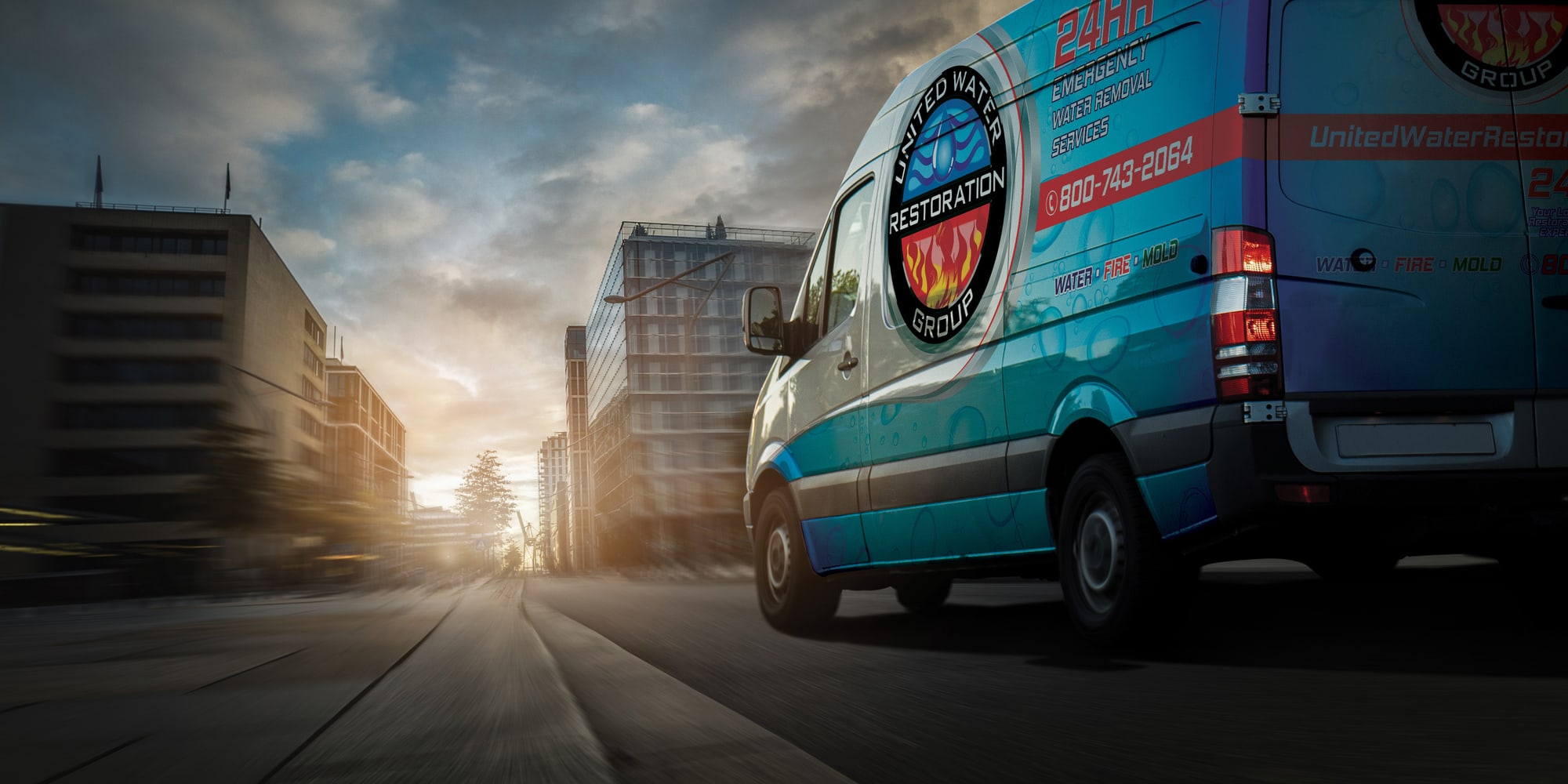 A United Water Restoration Group of Central Florida van heading out on an emergency call at sunset